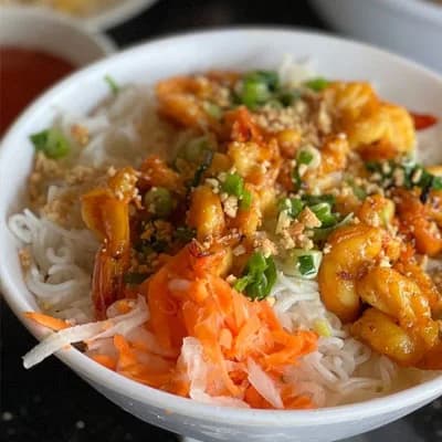 Vietnamese vermicelli noodle bowl with grilled meat and fresh vegetables