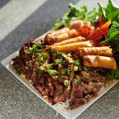 Vietnamese grilled meat with fresh vegetables and rice
